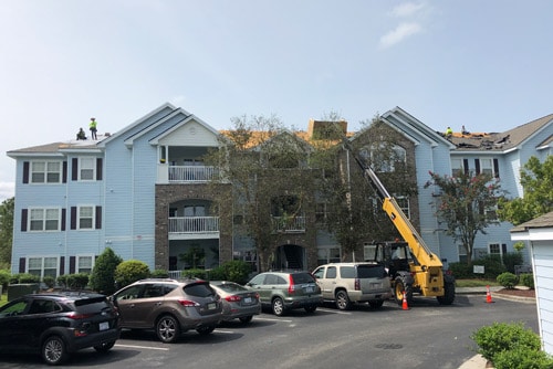 roofing-crew-replaces-apartment-building-roof